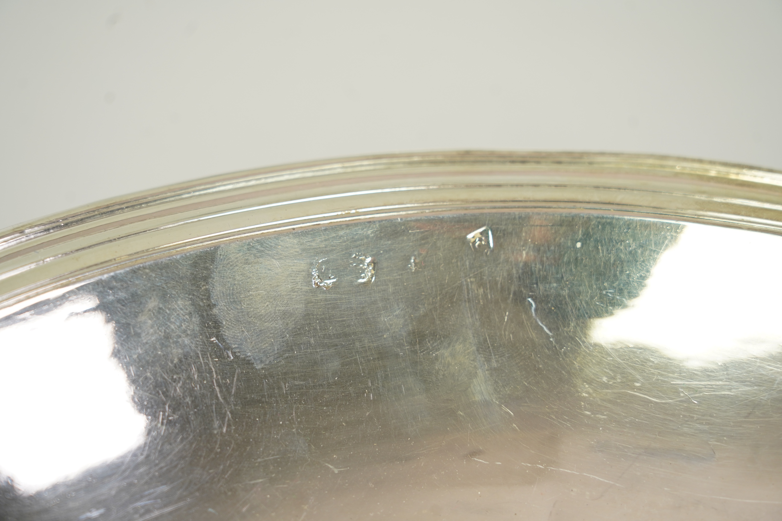 A rare late Charles II silver circular deep plate, makers mark 'D' (Jackson's reference P.139)